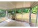Enclosed sunroom with views of the private, green backyard at 10016 Heathergate Ln, Mint Hill, NC 28227