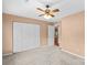 Bedroom features a ceiling fan and white folding closet doors at 103 Prestwick Ct, Salisbury, NC 28146