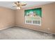 Bedroom features a ceiling fan and a window with curtains at 103 Prestwick Ct, Salisbury, NC 28146