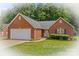 Lovely brick home featuring an attached two car garage, manicured lawn, and mature landscaping at 103 Prestwick Ct, Salisbury, NC 28146