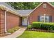 Close up of a home's front entrance with beautiful brickwork and landscaped shrubbery at 103 Prestwick Ct, Salisbury, NC 28146