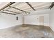 Spacious two car garage featuring white walls, a concrete floor, and an automatic garage door at 103 Prestwick Ct, Salisbury, NC 28146