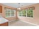 Sunny breakfast nook with large windows and a charming floral valance at 103 Prestwick Ct, Salisbury, NC 28146