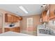 Bright kitchen showcasing wood cabinets, white countertops, double basin sink and neutral colored flooring at 103 Prestwick Ct, Salisbury, NC 28146