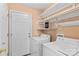Laundry room featuring a washer, dryer, shelving, and neutral walls at 103 Prestwick Ct, Salisbury, NC 28146