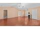 Spacious living room featuring vaulted ceiling, ceiling fan, and wood-look flooring at 103 Prestwick Ct, Salisbury, NC 28146