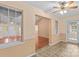 Living room featuring large windows, ceiling fan, and tiled floor at 103 Prestwick Ct, Salisbury, NC 28146