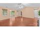 Bright living room with vaulted ceiling, ceiling fan, and wood-look flooring at 103 Prestwick Ct, Salisbury, NC 28146