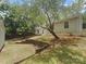 Backyard view shows a spacious yard with a retaining wall at 10931 Osprey Dr, Charlotte, NC 28226