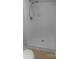 Bright white bathroom shower with tile walls and updated shower head at 10931 Osprey Dr, Charlotte, NC 28226