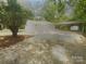 This property features an expansive multi-car garage and an attached carport at 10931 Osprey Dr, Charlotte, NC 28226