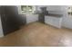 Spacious kitchen with white cabinets, black appliances, tile floors, and ample counter space at 10931 Osprey Dr, Charlotte, NC 28226