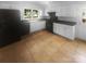 Large kitchen with tile floors, white cabinetry, black countertops and appliances, plus a backyard view at 10931 Osprey Dr, Charlotte, NC 28226
