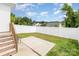 The backyard shows a fenced-in yard with a grassy area and a small concrete patio at 1117 Laurel Woods Dr, Gastonia, NC 28052