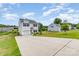 Charming two-story home features an attached garage, lovely landscaping, and a long driveway at 1117 Laurel Woods Dr, Gastonia, NC 28052