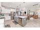 The kitchen features white cabinets, an island with a sink, and stainless steel appliances at 1117 Laurel Woods Dr, Gastonia, NC 28052