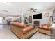 Cozy living room with a fireplace, ceiling fan, and an open floor plan at 1117 Laurel Woods Dr, Gastonia, NC 28052