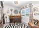 Bright living room boasts a bar area, a window with blinds, decorative wall art and a zebra print rug at 1117 Laurel Woods Dr, Gastonia, NC 28052