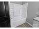 Bathroom features a white shower and granite countertop at 1210 Cloninger Ave, Gastonia, NC 28052