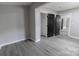 A bedroom features light gray walls and gray vinyl flooring; an open floor plan offering flexibility at 1210 Cloninger Ave, Gastonia, NC 28052