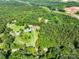 Expansive wooded lot, showcasing the property's privacy and natural surroundings at 12143 Asbury Chapel Rd, Huntersville, NC 28078