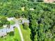 Property surrounded by lush greenery and mature trees at 12143 Asbury Chapel Rd, Huntersville, NC 28078