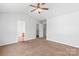 Spacious bedroom featuring a ceiling fan and carpeted floors at 12452 Stratfield Place Cir, Pineville, NC 28134