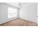 This is a bright bedroom with neutral walls and a window at 12452 Stratfield Place Cir, Pineville, NC 28134