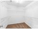 Walk-in closet featuring wire shelving and carpeted floors at 12452 Stratfield Place Cir, Pineville, NC 28134