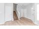 Bright entryway featuring a staircase, fresh paint, wood-look flooring, and neutral tones at 12452 Stratfield Place Cir, Pineville, NC 28134