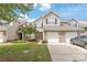 Charming townhouse with a well-maintained lawn, two-car garage, and a welcoming brick facade at 12452 Stratfield Place Cir, Pineville, NC 28134