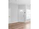Bright living area with a white front door, modern flooring, and neutral tones at 12452 Stratfield Place Cir, Pineville, NC 28134