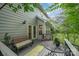 Cozy outdoor deck with comfortable seating and a view of the backyard at 13416 Kintyre Ct, Matthews, NC 28105
