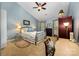 Spacious bedroom with vaulted ceiling, ceiling fan, and neutral carpet at 13416 Kintyre Ct, Matthews, NC 28105