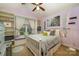 Cozy bedroom featuring built-in shelves, window seat, and zebra-themed decor at 13416 Kintyre Ct, Matthews, NC 28105