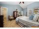 Bedroom with blue walls and carpet, and features a walk-in closet at 13416 Kintyre Ct, Matthews, NC 28105