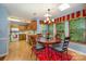 Dining area with skylight situated next to the kitchen area with modern appliances at 13416 Kintyre Ct, Matthews, NC 28105
