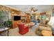 Spacious living room with a brick fireplace, built-in shelves, and cozy furniture for relaxation at 13416 Kintyre Ct, Matthews, NC 28105