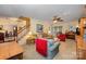 Large, bright living room with a staircase, warm colors, and ample seating, perfect for entertaining at 13416 Kintyre Ct, Matthews, NC 28105