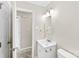 Bathroom with a sink, mirror, lighting, and a doorway leading to another room at 1617 Mulberry Cir, Rock Hill, SC 29732