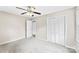 Cozy bedroom with a ceiling fan, closet, and neutral carpet at 1617 Mulberry Cir, Rock Hill, SC 29732
