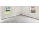 Bedroom with neutral walls, two windows, and carpet flooring at 1617 Mulberry Cir, Rock Hill, SC 29732