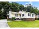 Charming ranch home with a brick foundation, lovely landscaping and a cozy front porch at 1617 Mulberry Cir, Rock Hill, SC 29732
