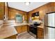 Kitchen with wood cabinets, stainless steel appliances, and tile backsplash at 1617 Mulberry Cir, Rock Hill, SC 29732