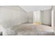Living room featuring paneled walls and neutral carpet, creating a cozy space at 1617 Mulberry Cir, Rock Hill, SC 29732
