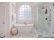 A bright bathroom featuring a soaking tub and glass shower at 184 Melbourne Dr, Fort Mill, SC 29708