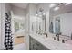 Modern bathroom featuring dual sinks, stylish fixtures, sleek mirrors, and elegant tile flooring at 184 Melbourne Dr, Fort Mill, SC 29708