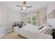 Bedroom with large window and view, comfortable bed, and a computer setup for work at 184 Melbourne Dr, Fort Mill, SC 29708