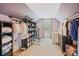 Spacious walk-in closet offers ample storage, custom shelving, and natural light from the window at 184 Melbourne Dr, Fort Mill, SC 29708