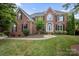 Charming brick two-story home with manicured lawn and arched doorway, perfect for curb appeal at 184 Melbourne Dr, Fort Mill, SC 29708